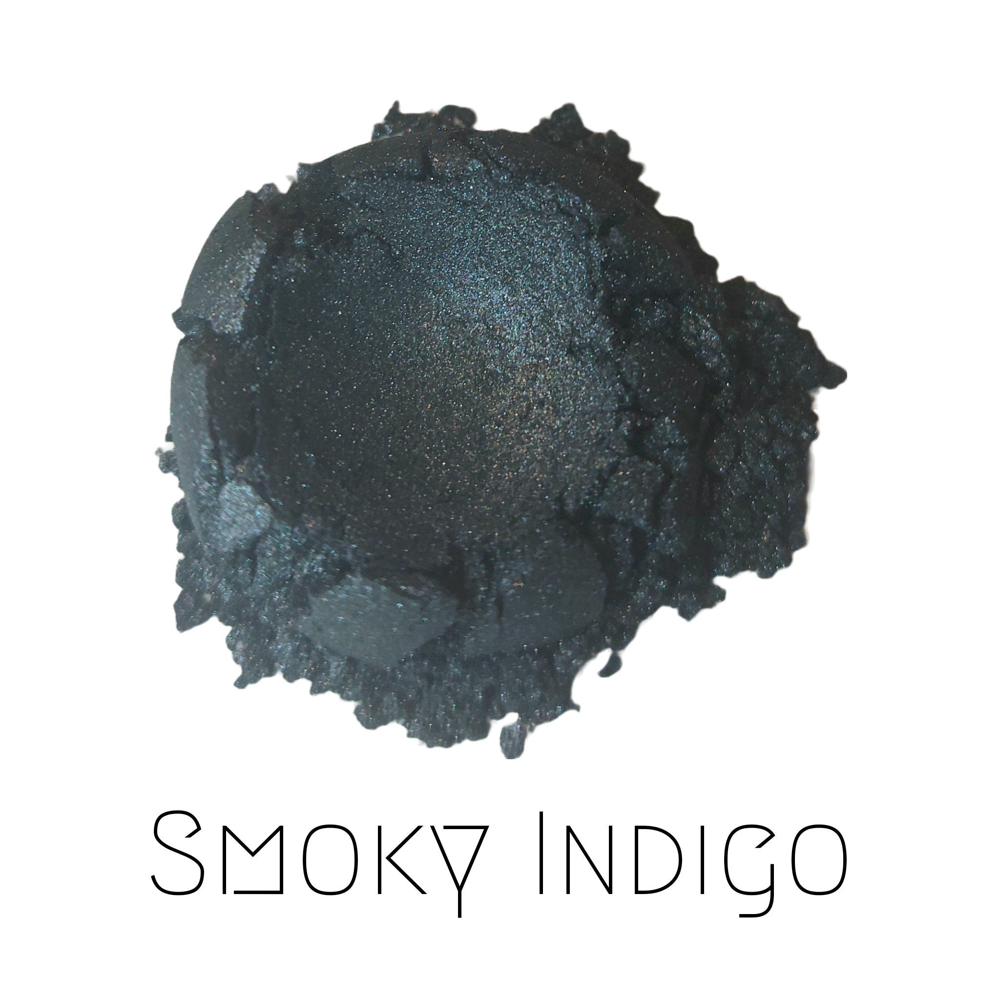 Vegan eyeshadow duo in smoky indigo and shimmery deep aubergine shades with eco-friendly compact packaging