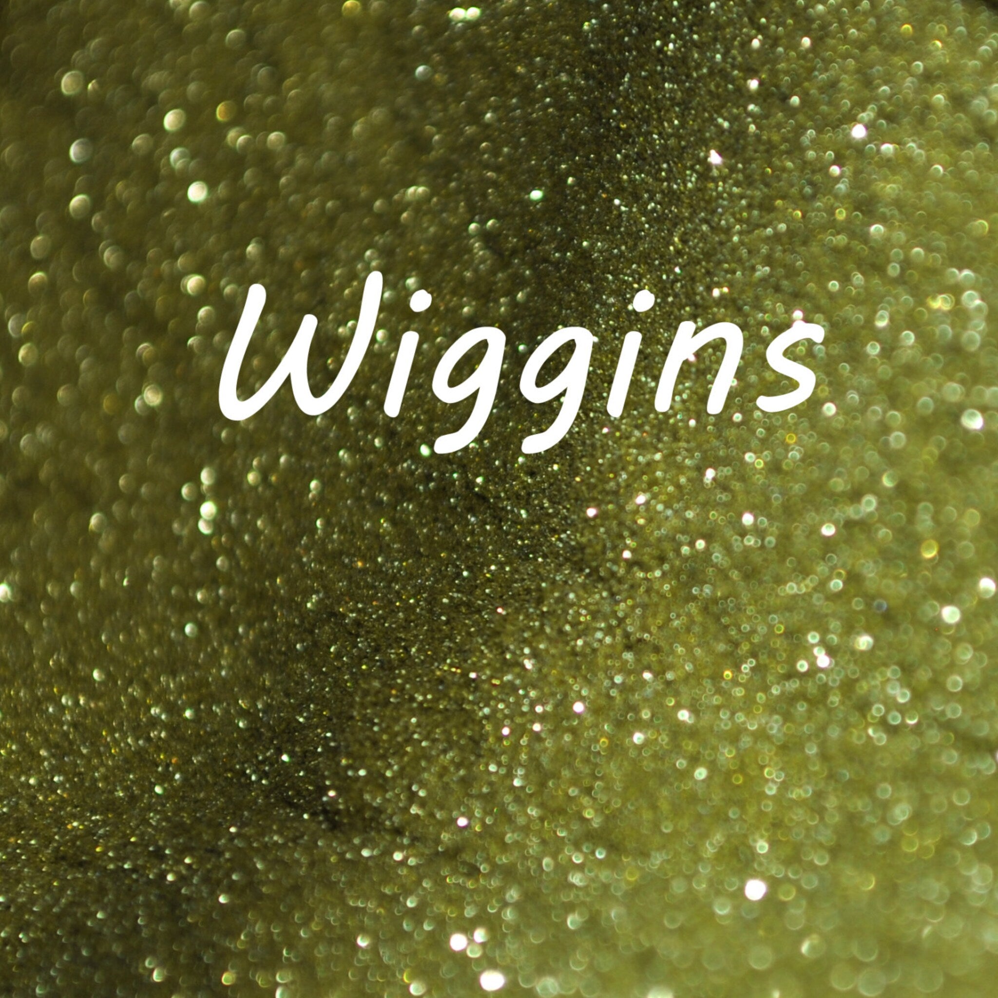 Small glass jar of Wiggins glitter eye shadow with sifter lid, showcasing vibrant sparkles in a single shade