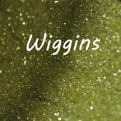 Small glass jar of Wiggins glitter eye shadow with sifter lid, showcasing vibrant sparkles in a single shade