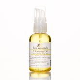 Cleansing Oil bottle with yellow liquid, white label, and clear pump top, Bee Naturals brand