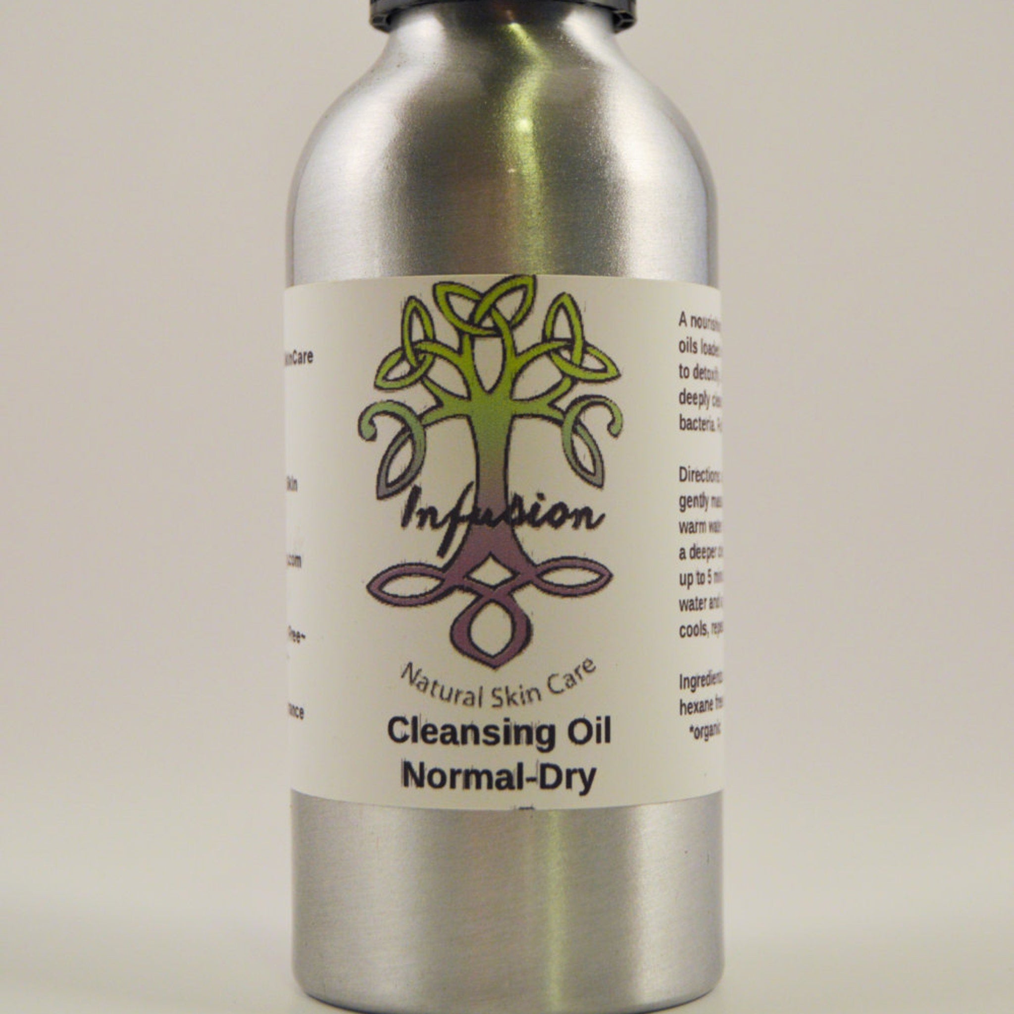 Cleansing oil bottle, silver metal, white label with Infusion logo and text Normal-Dry