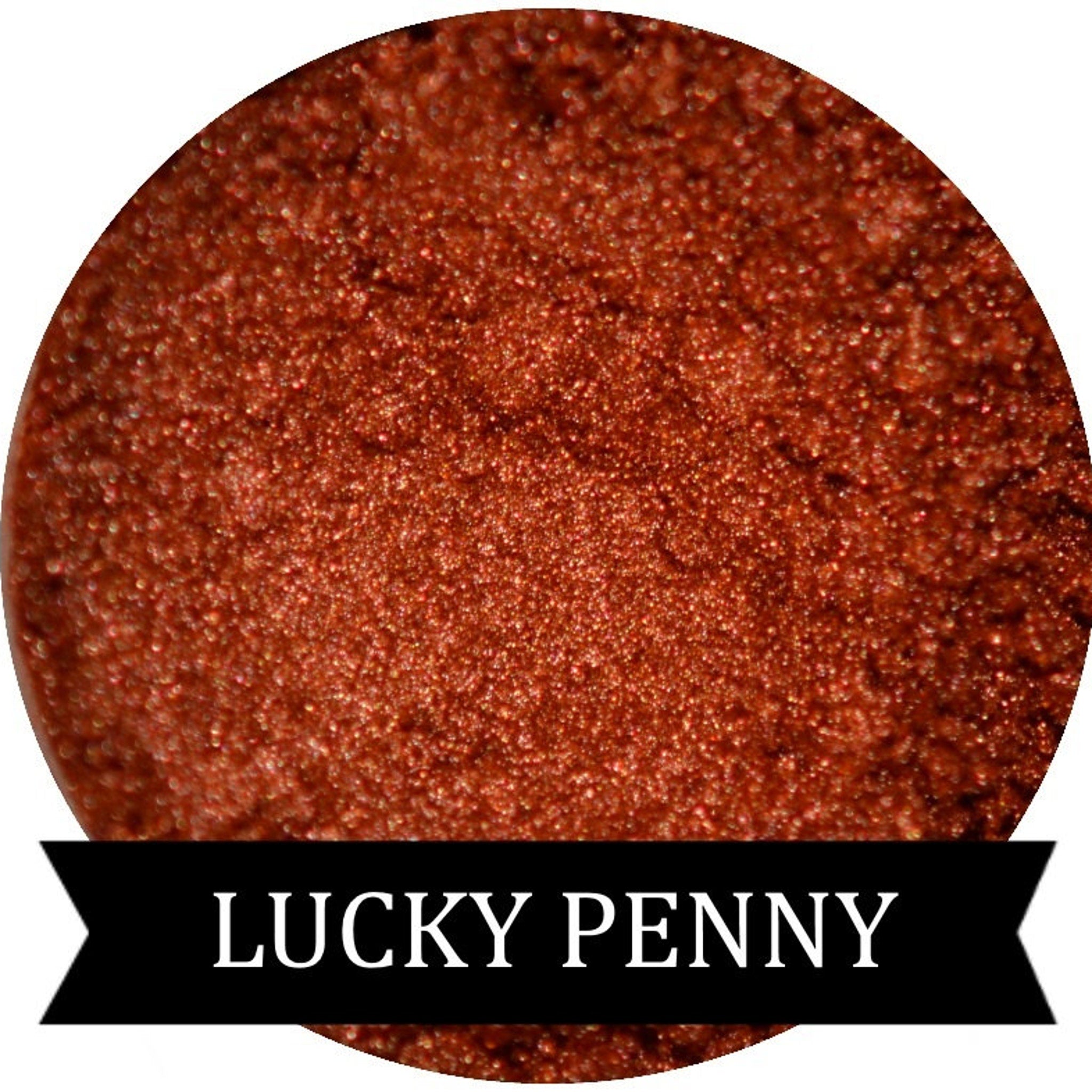 Copper eye shadow makeup with speckled texture, metallic sheen, and LUCKY PENNY brand text