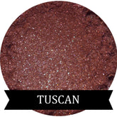 Single eyeshadow pan with smooth matte finish in muted brown plum shade, displayed on clean white background.