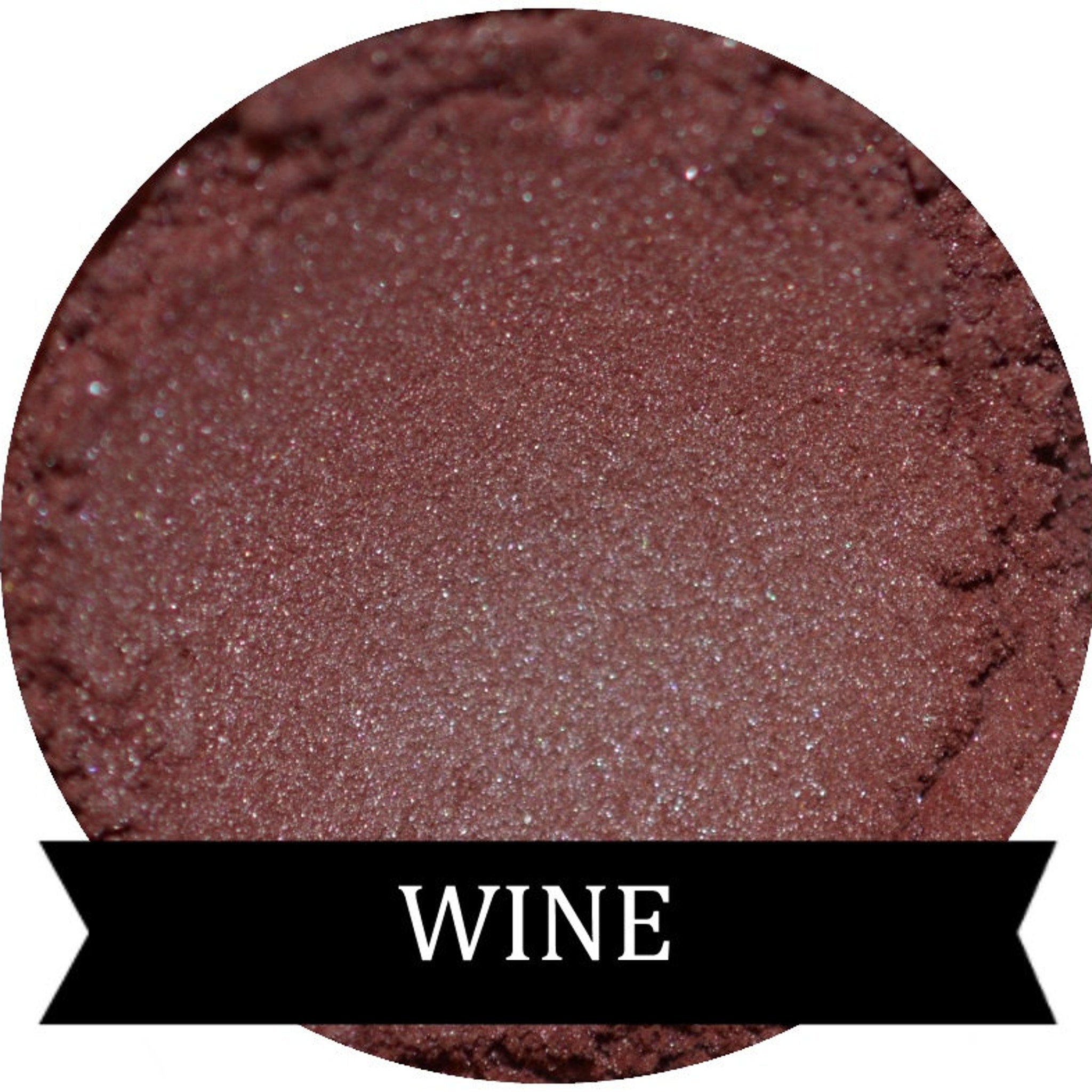 Single pan of burgundy wine eyeshadow with satin finish in sleek black compact