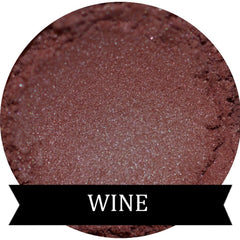 Single pan of burgundy wine eyeshadow with satin finish in sleek black compact