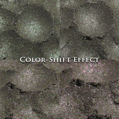 Color-shift effect eyeshadow in dark gray with glitter and "COLOR-SHIFT EFFECT" text overlay