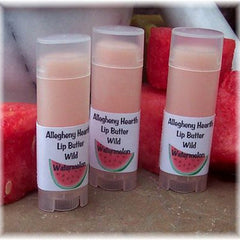 Lip butter tubes, light pink color, clear cap, with Allegheny Hearth label and watermelon graphic