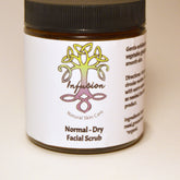 Facial scrub jar with black lid, white label, and Infusion Natural Skin Care text