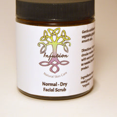 Facial scrub jar with black lid, white label, and Infusion Natural Skin Care text