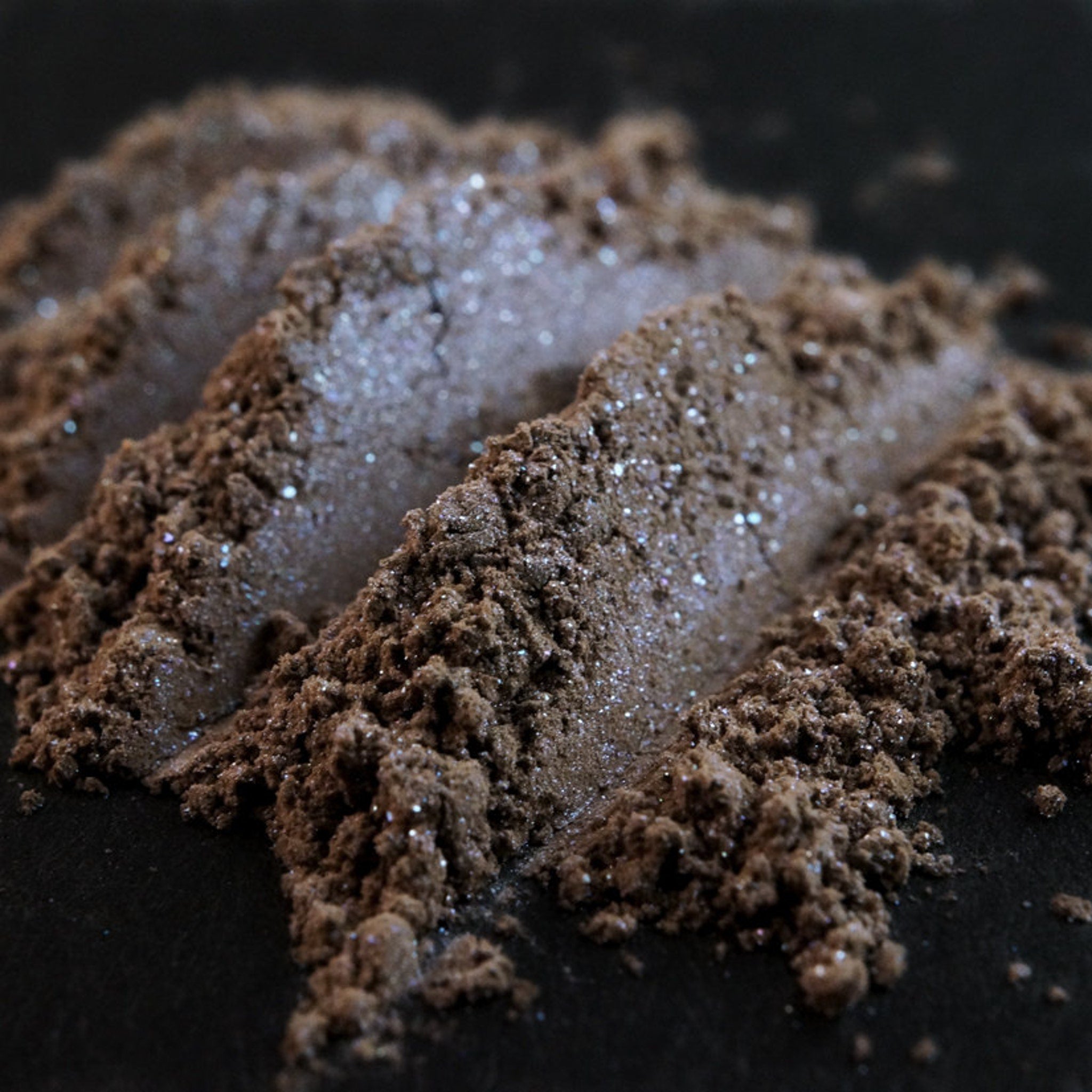 Gallows Hill Taupe eyeshadow compact open, showcasing beige powder with silver and blue shimmer