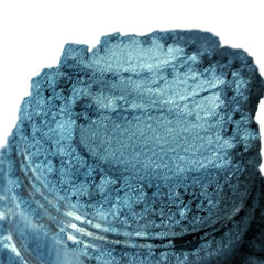 Blue-green powder with sparkly texture in a clear jar, Crush brand