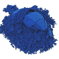 Side view of organic cornflower and periwinkle blue eye shadow pan showing pressed powder texture