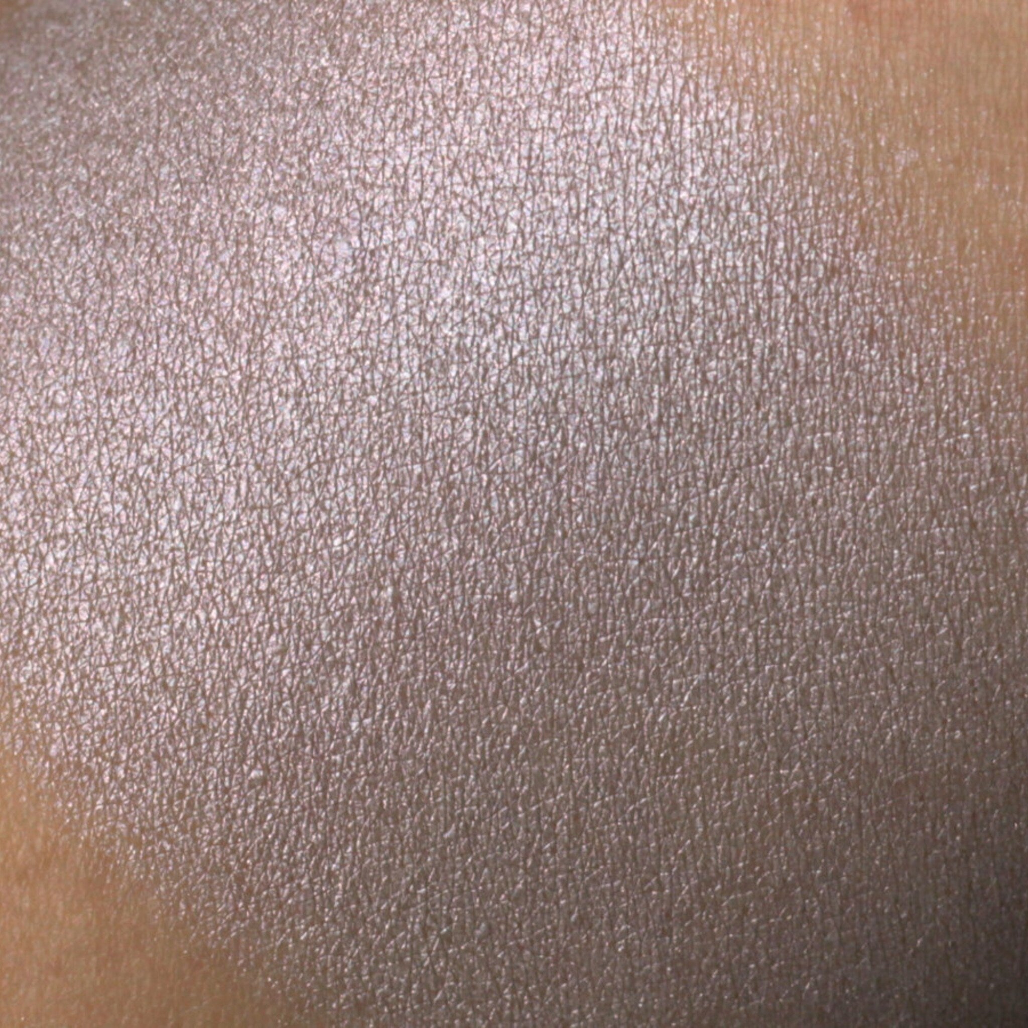 Frosty silver gray eyeshadow compact with lavender shimmer, showcasing vegan mineral makeup in sleek packaging