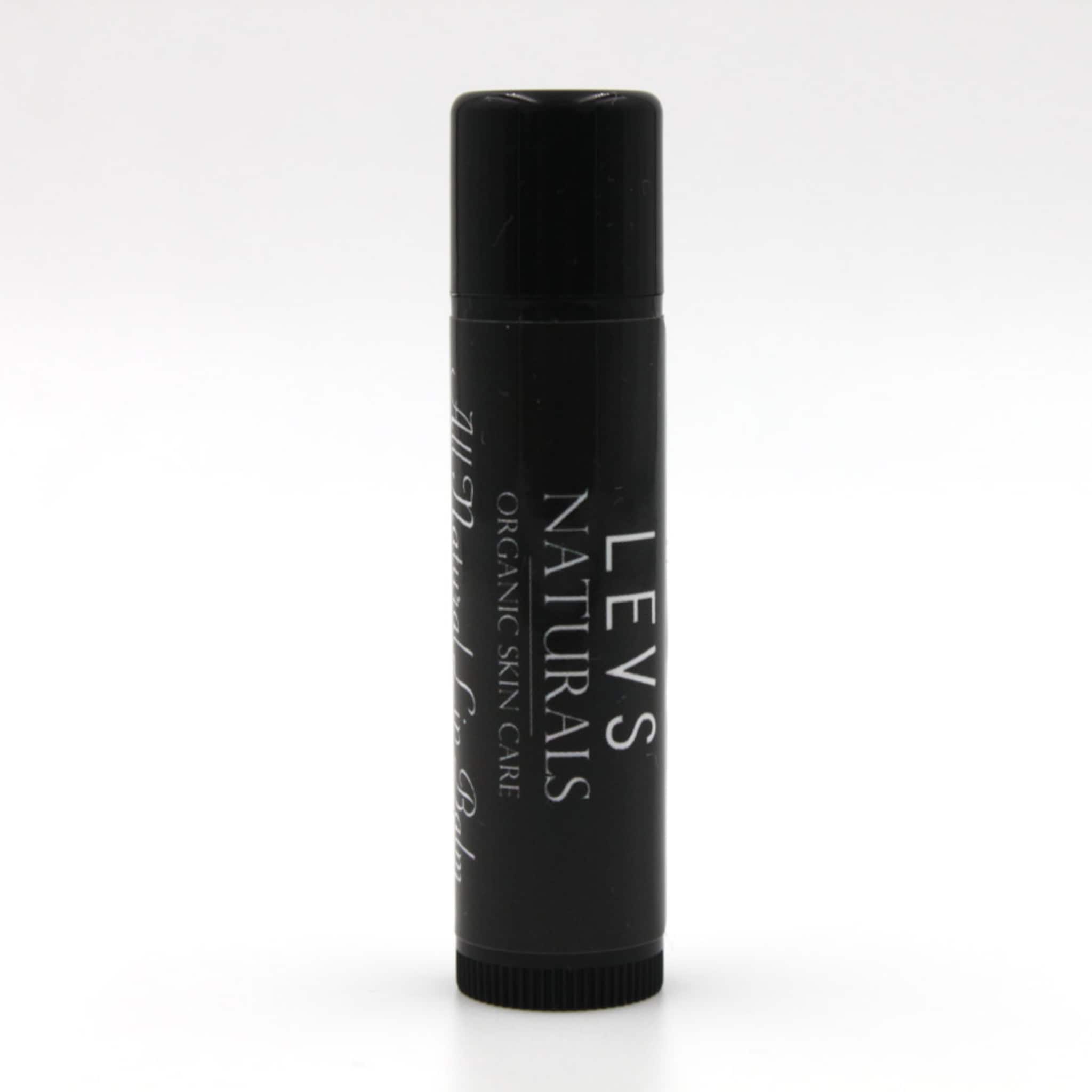 Lip balm tube in black with white text, LEVS NATURALS brand visible, cylindrical shape