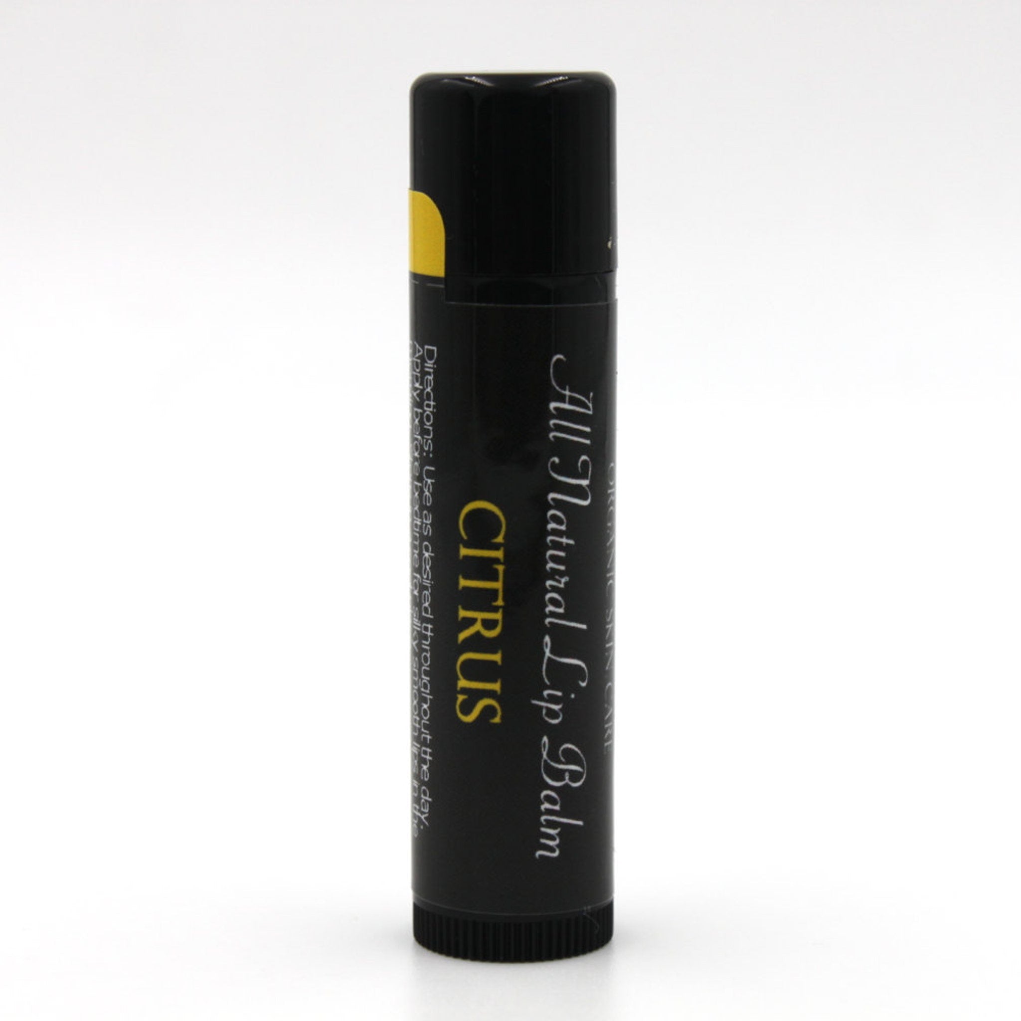 Lip balm in black tube with yellow accent and "CITRUS" text, for lip care
