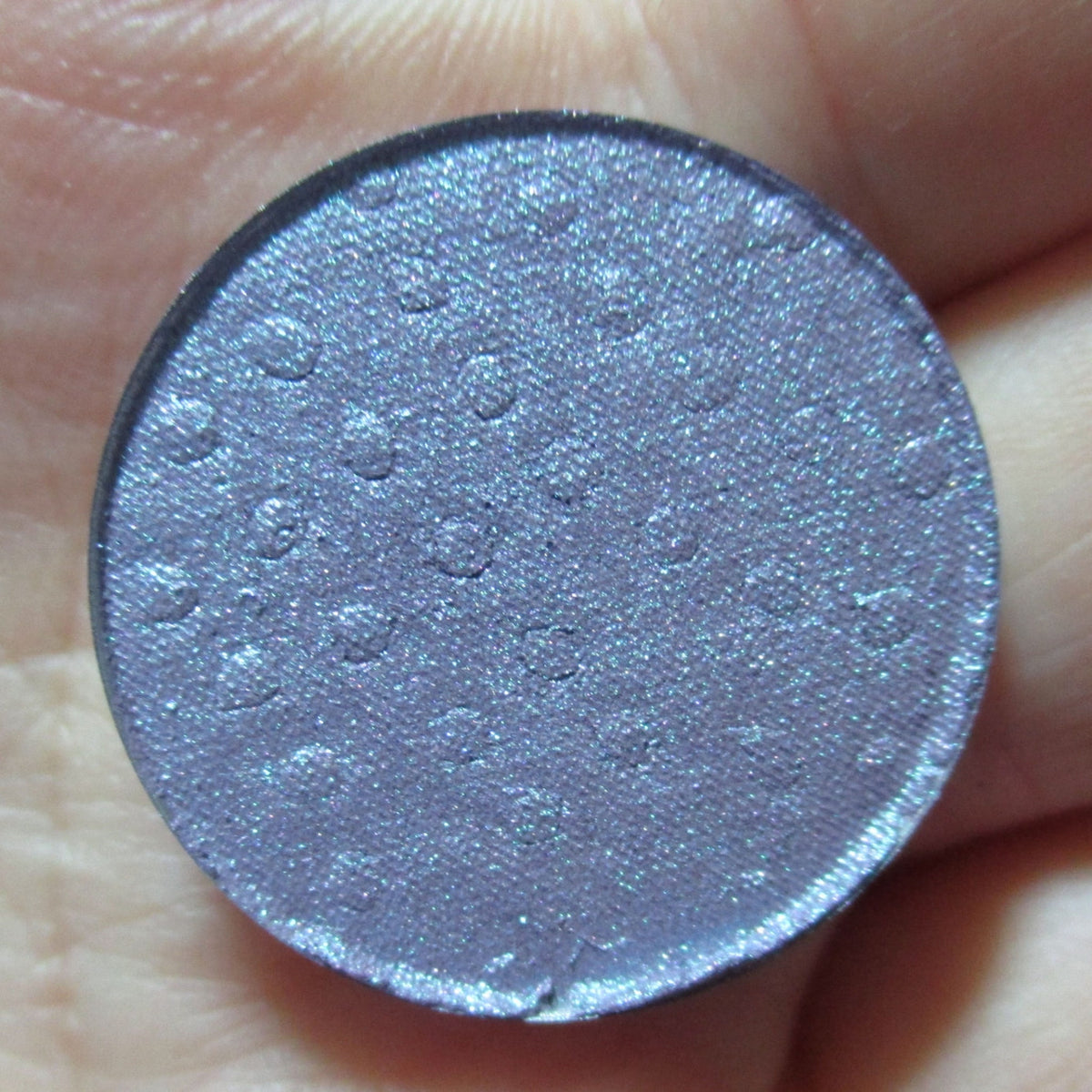Moonlight Masquerade Eye Shadow palette with shimmering silver, deep navy, and matte black shades in sleek black compact