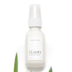 Acne treatment moisturizer bottle, white glass, pump top, Teava Skincare label visible