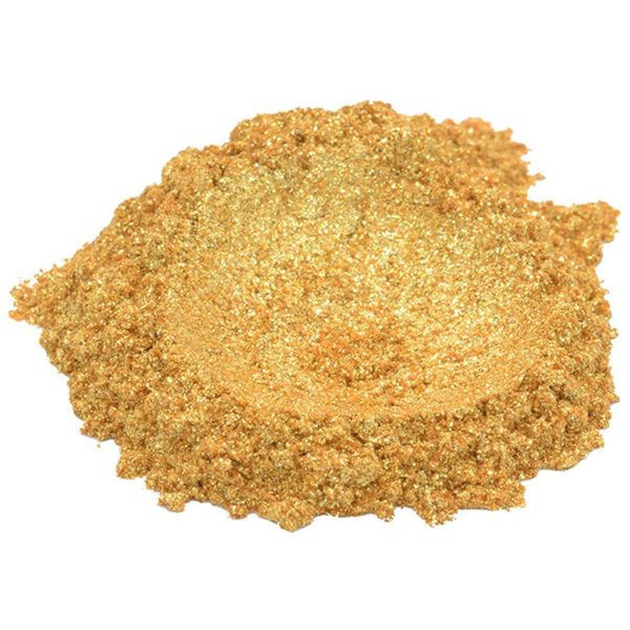 Hand applying 24K gold yellow mica pigment powder to eyelid with brush, showcasing shimmering metallic finish