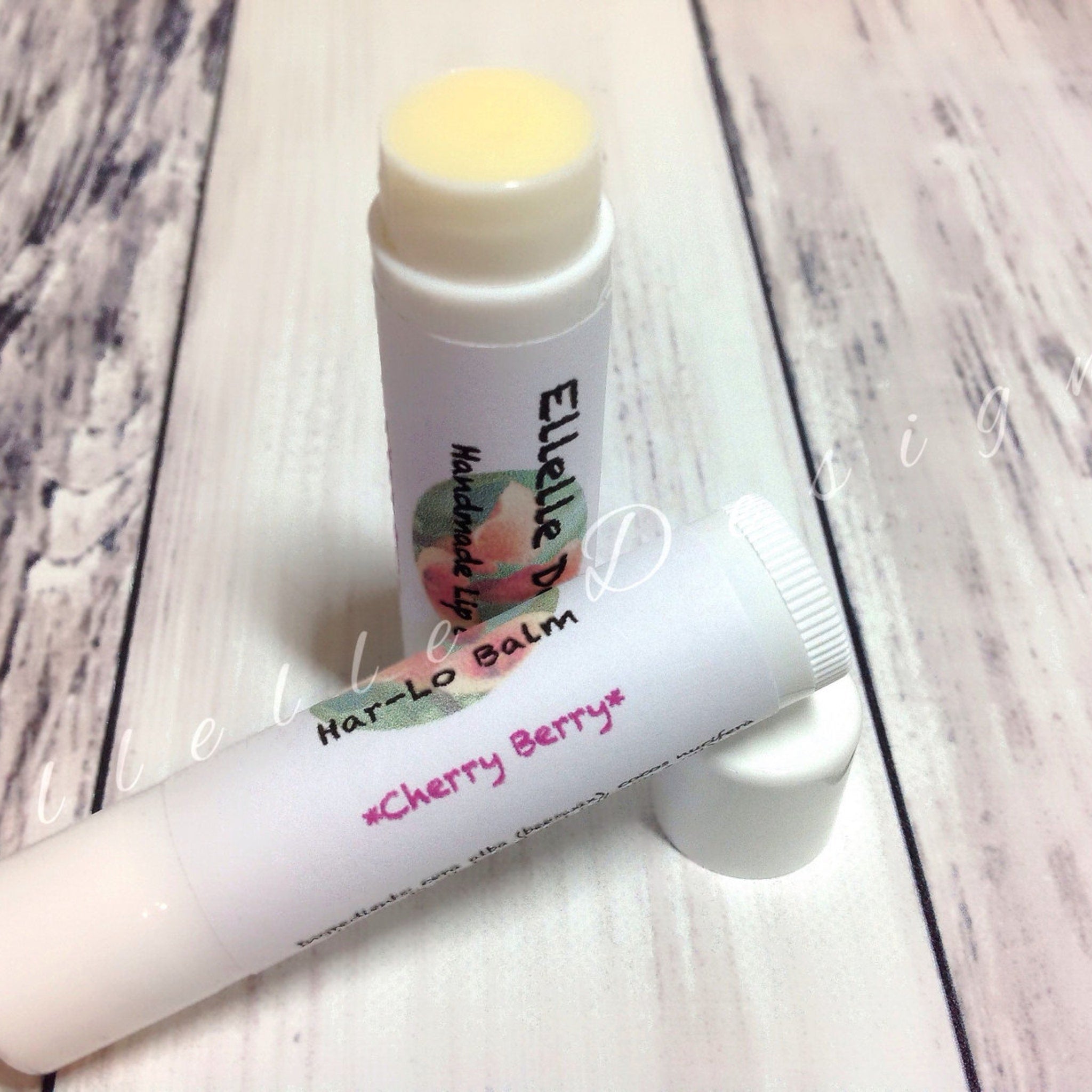 Lip balm tubes with white and pink text, yellow balm, and Har,Lo brand name visible
