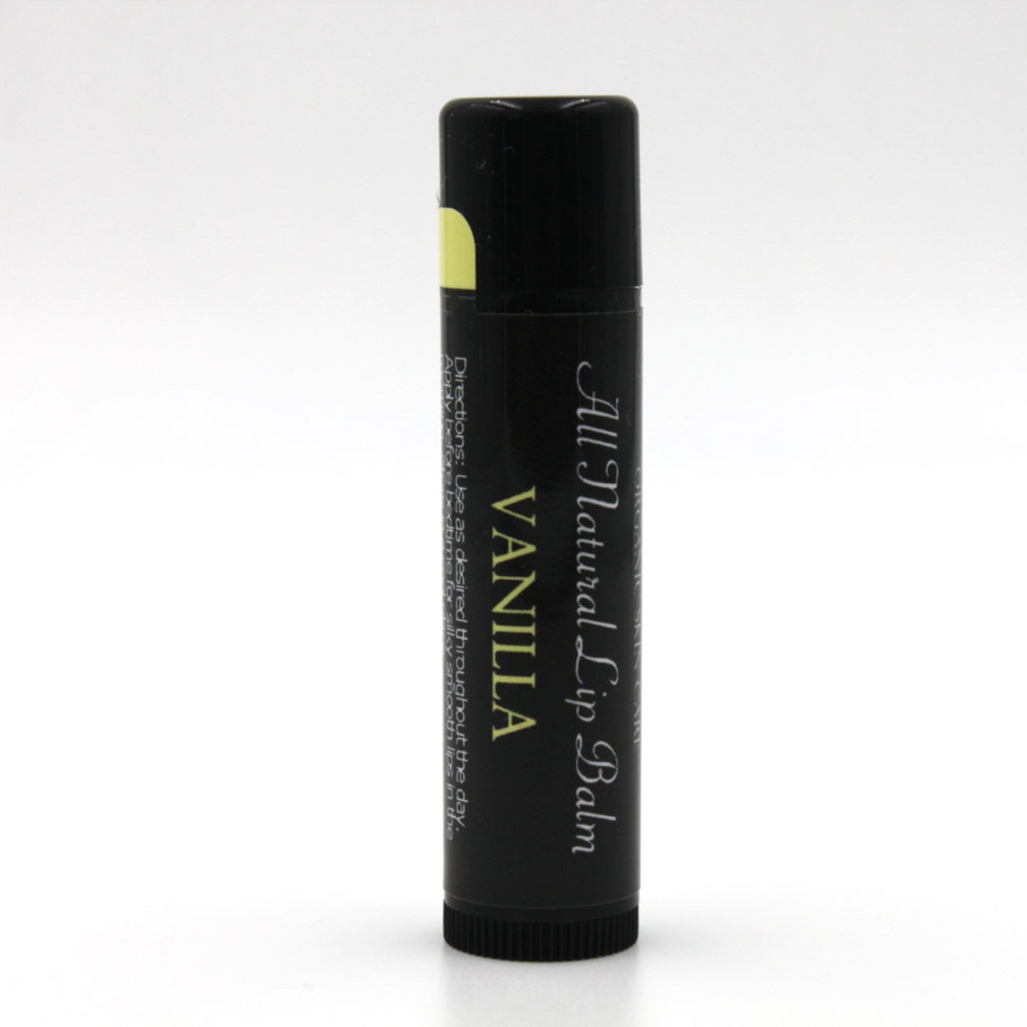 Lip balm tube with black and white label, "VANILLA" text, for lip care