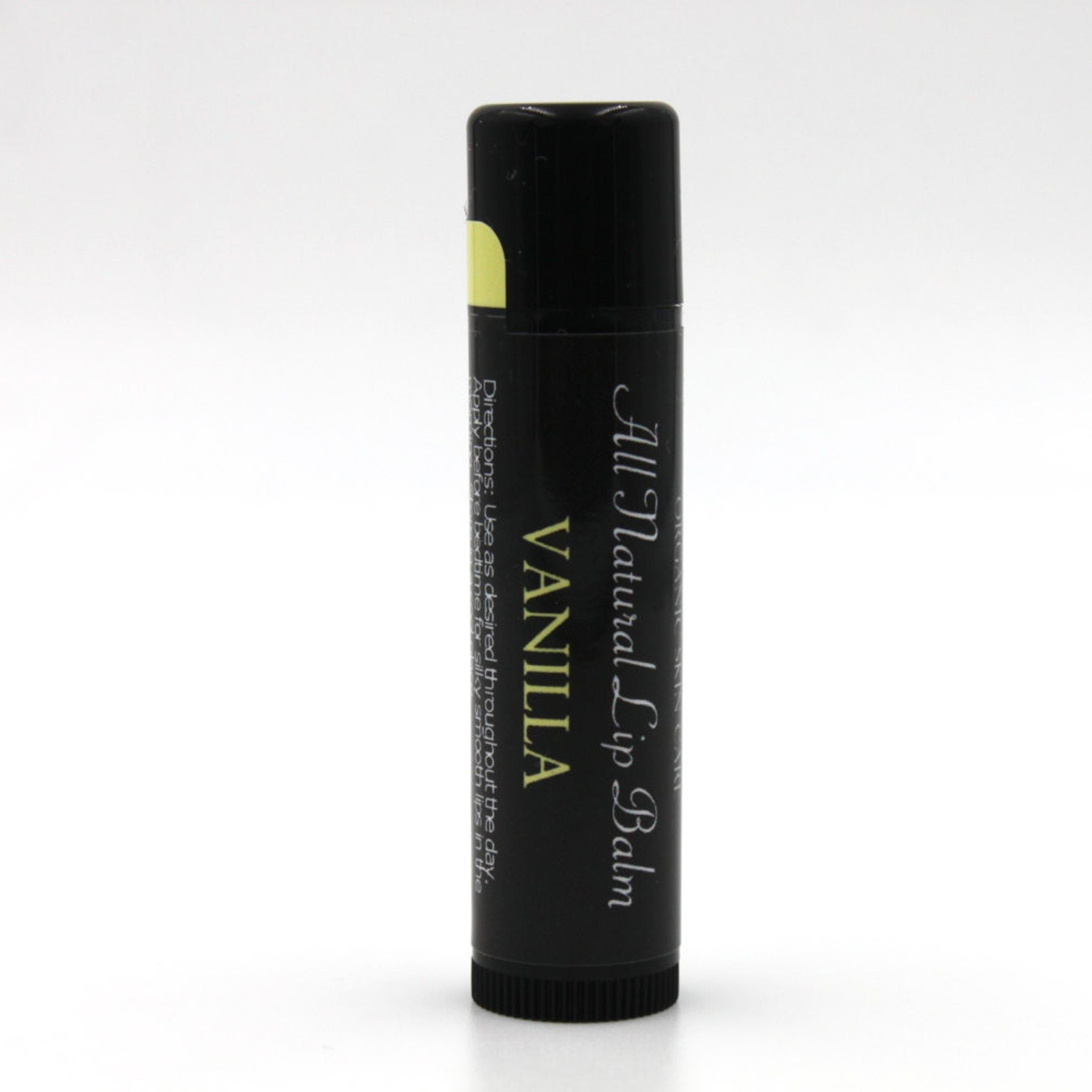 Lip balm tube with black and yellow label, Vanilla flavor, for lip care
