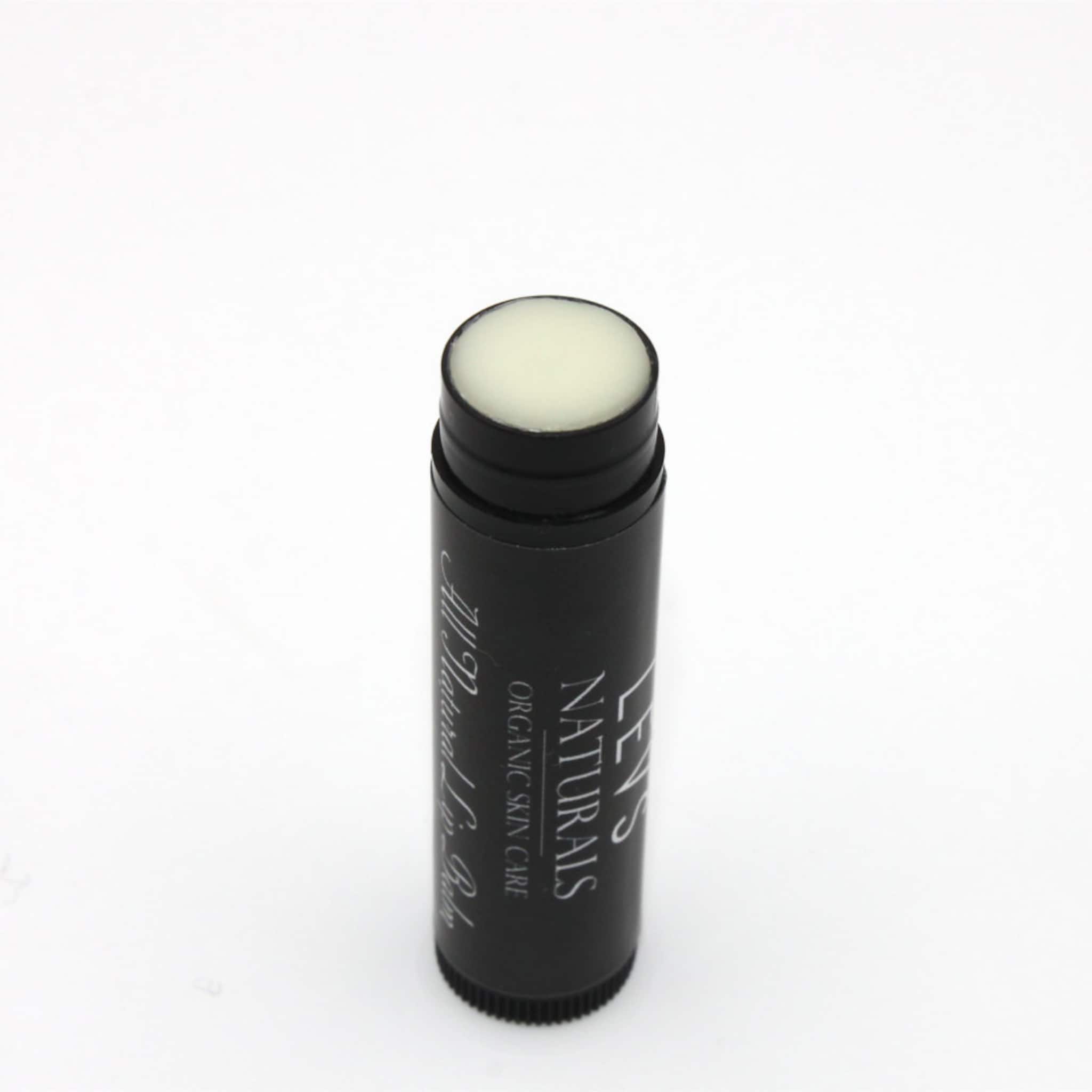 Lip balm stick with black tube, white product, and LEV'S NATURALS text visible