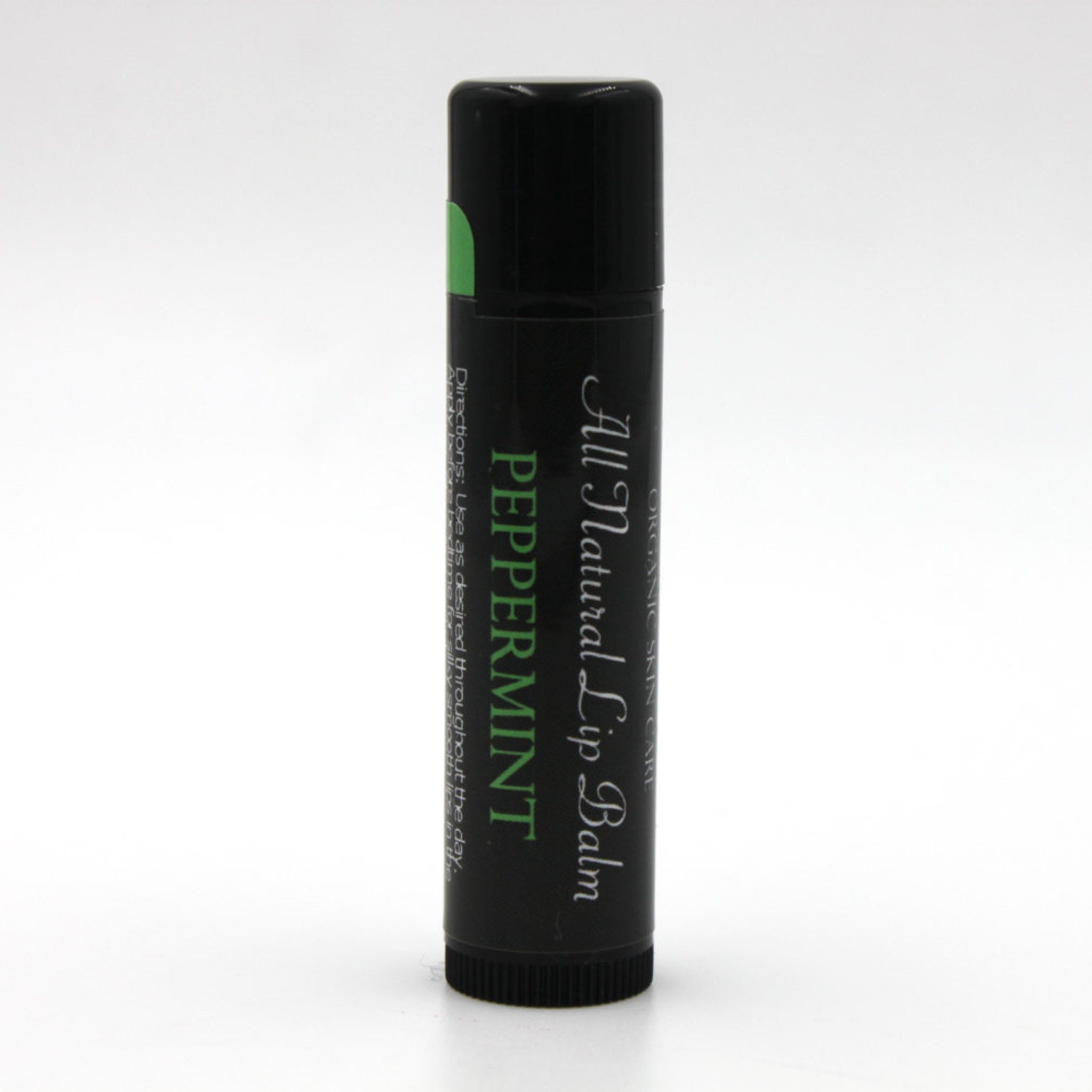 Lip balm tube with black body, green label, and white text for peppermint flavor
