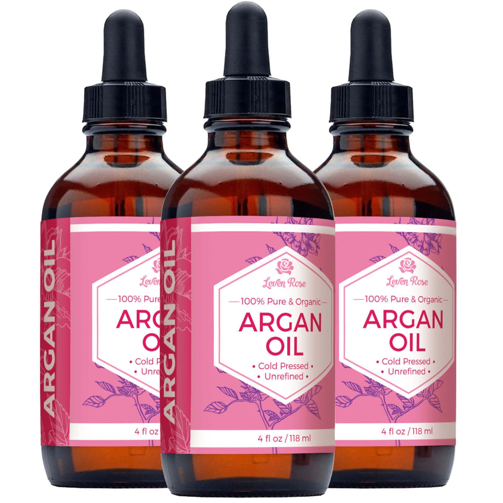 Amber glass bottle with gold dropper containing pure cold-pressed argan oil, sunlight highlighting its golden hue