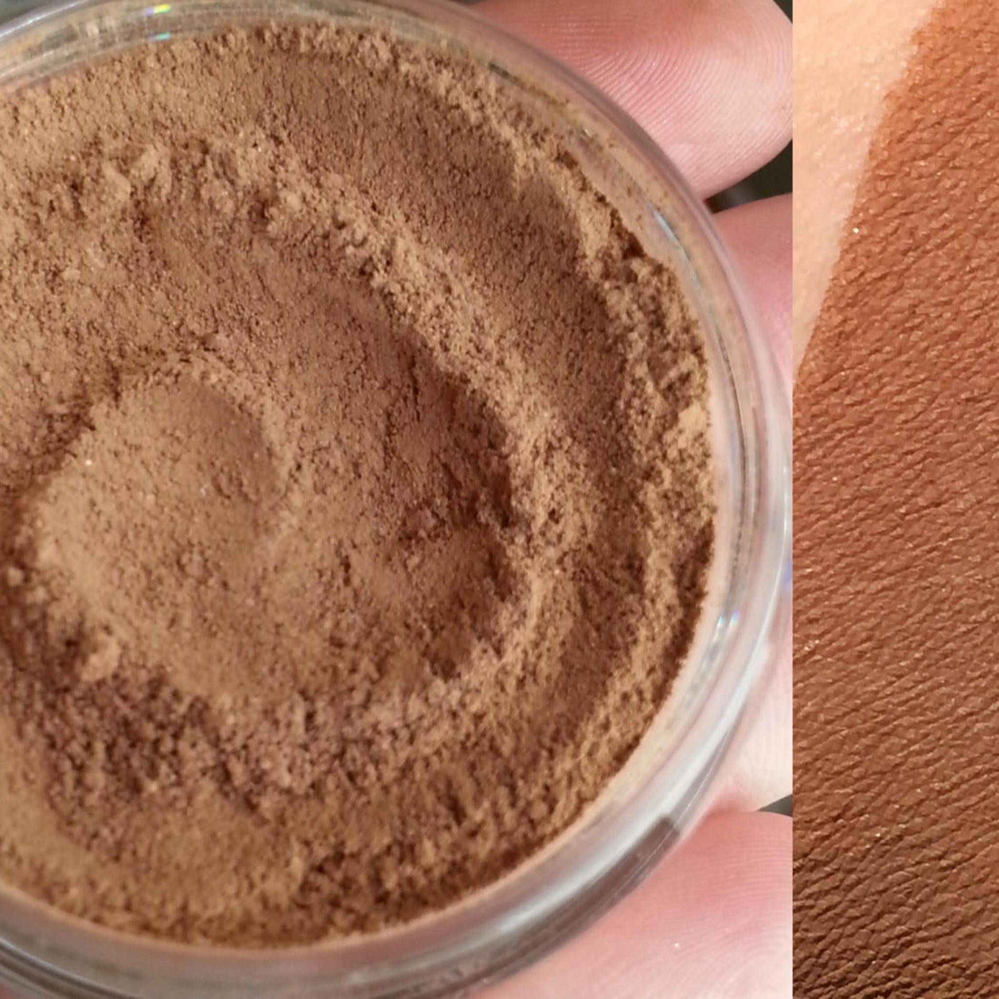 Brown powder makeup in a clear container, with a skin swatch showing color and texture