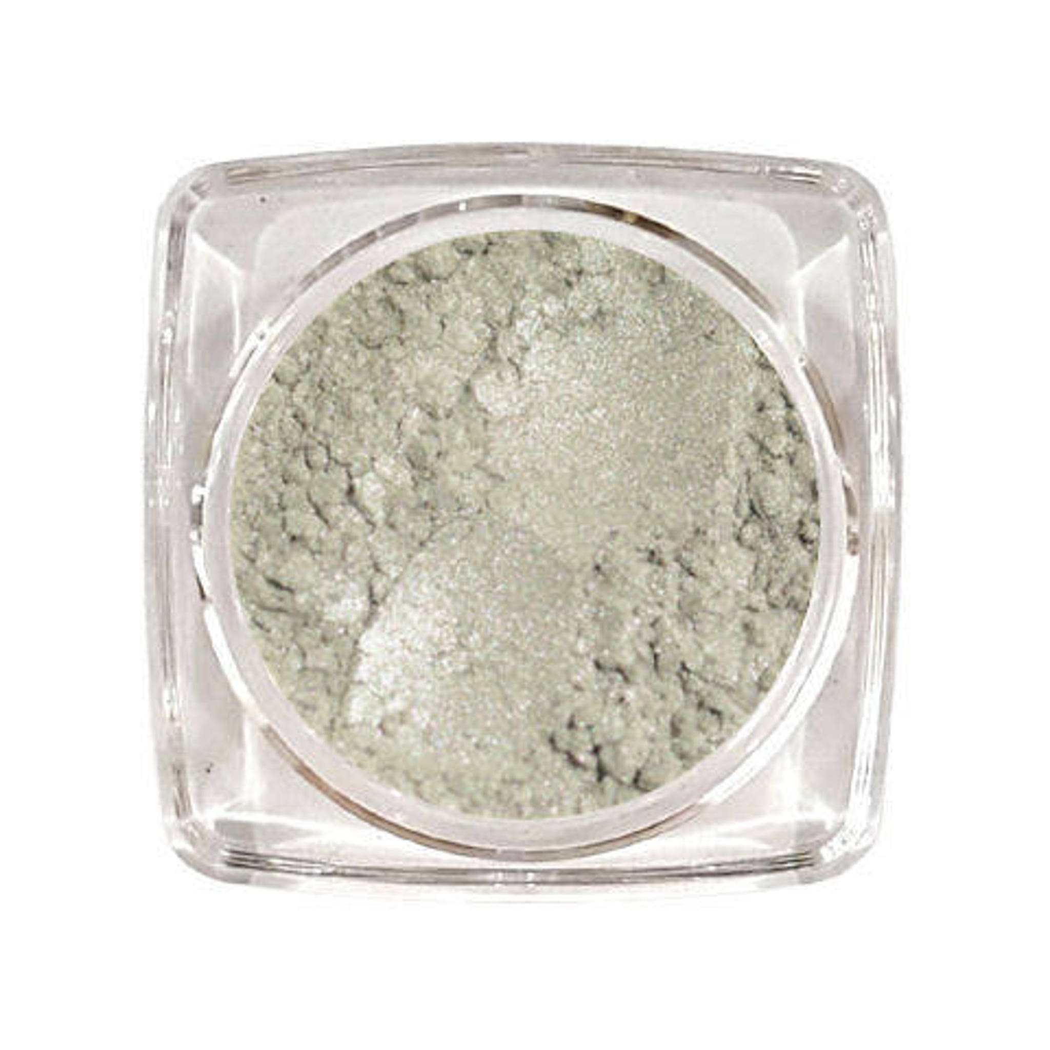 Silver sand eyeshadow in a round glass jar with black screw-top lid and subtle metallic sheen