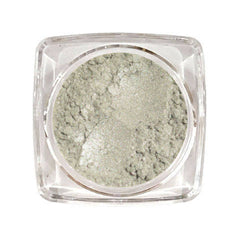 Silver sand eyeshadow in a round glass jar with black screw-top lid and subtle metallic sheen