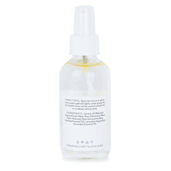 Facial mist spray bottle, clear glass, white cap, From Molly With Love label visible