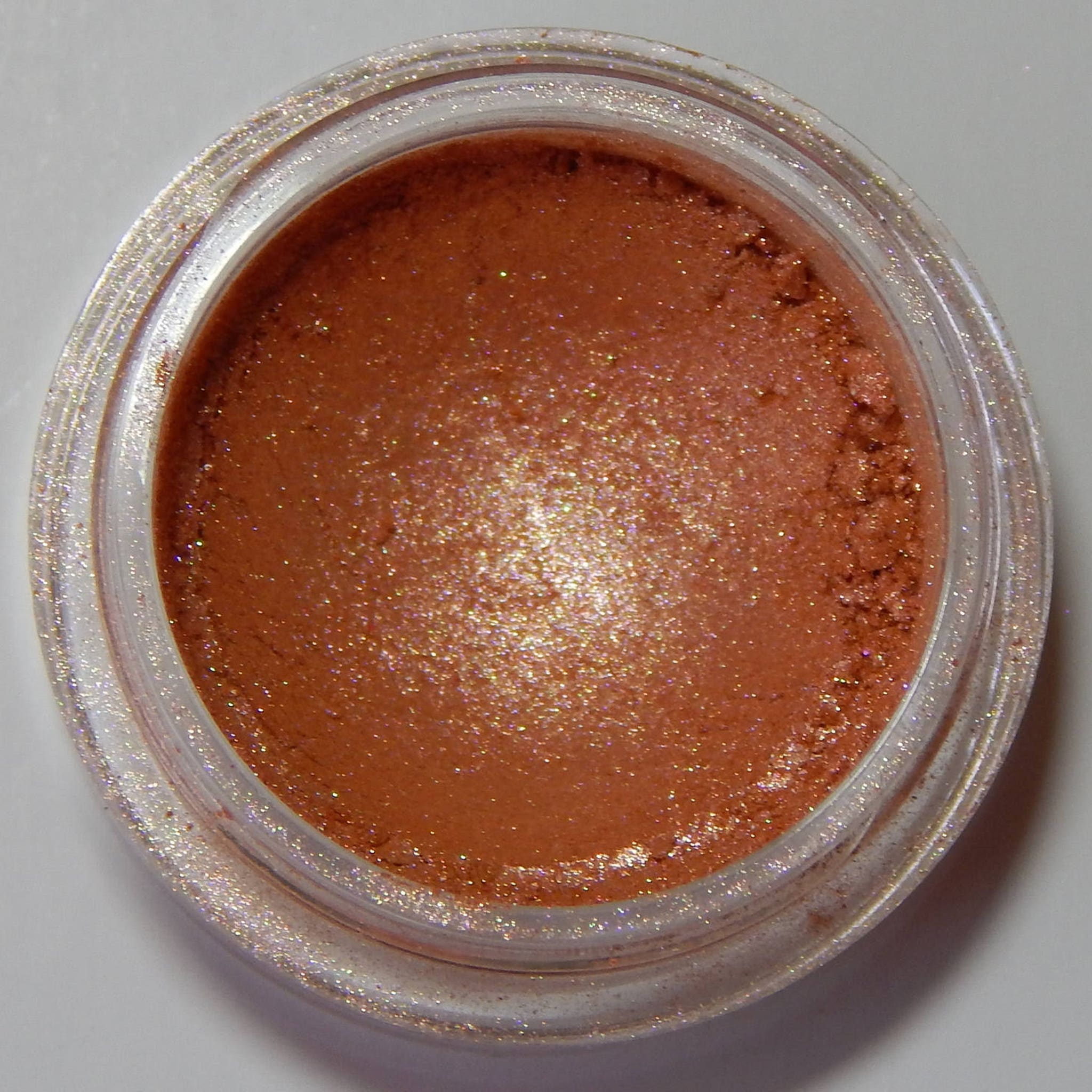 Gold Blush eye shadow compact with shimmering metallic finish and smooth pressed powder texture