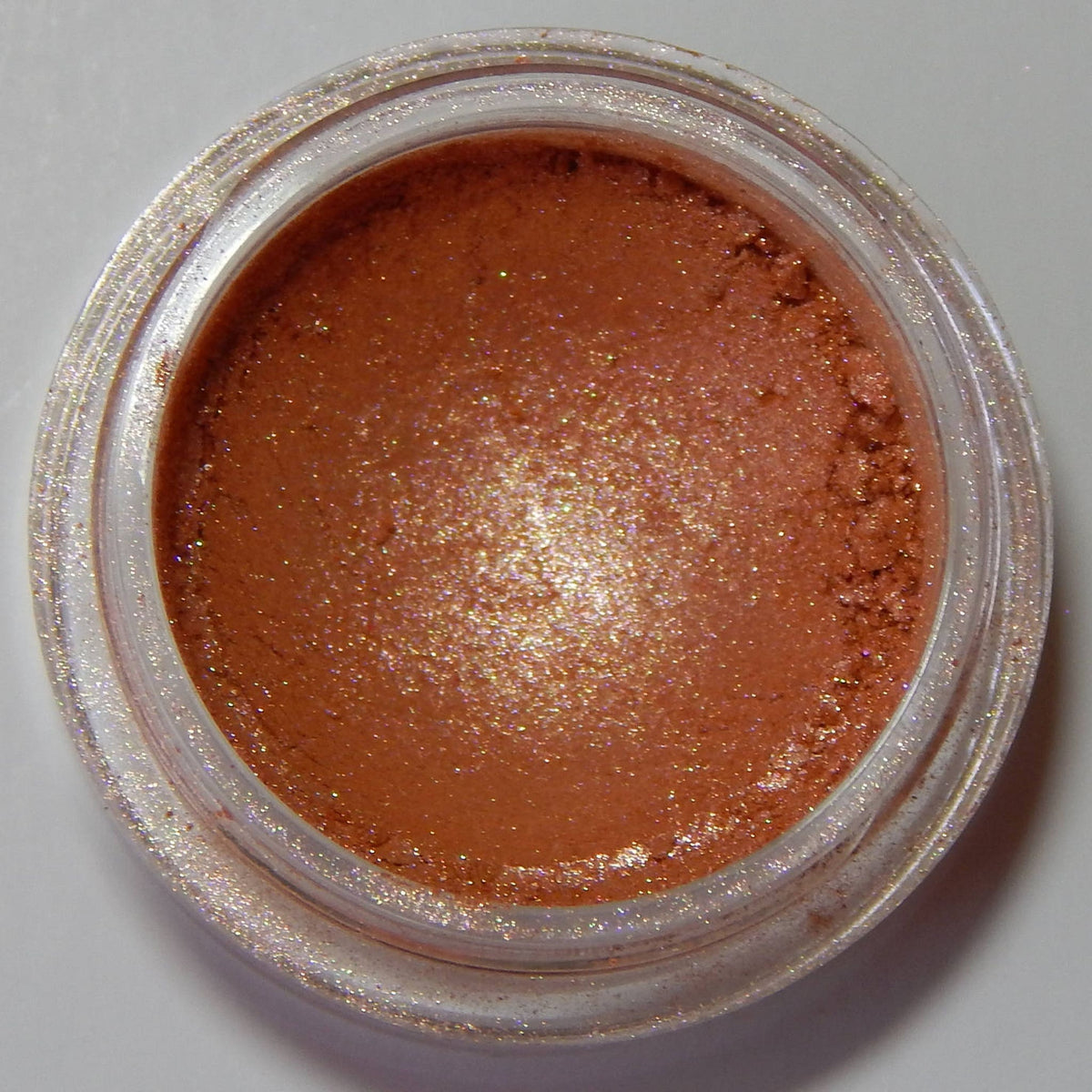 Gold Blush eye shadow compact with shimmering metallic finish and smooth pressed powder texture