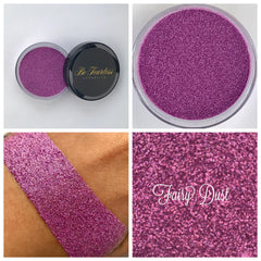 Close-up of Fairy Dust loose glitter in a small round jar with iridescent pink and silver sparkles