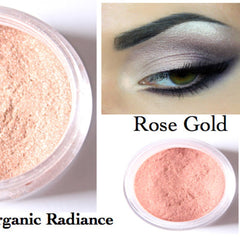 Close-up of loose rose gold mineral eyeshadow with shimmer particles, showcasing fine powder texture