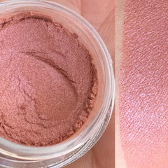 Close-up of matte and shimmer brown eyeshadow palette with vegan-friendly labeling, showcasing rich earthy tones