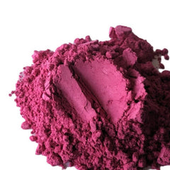Pink eyeshadow powder, matte texture, loose mineral makeup, close-up view