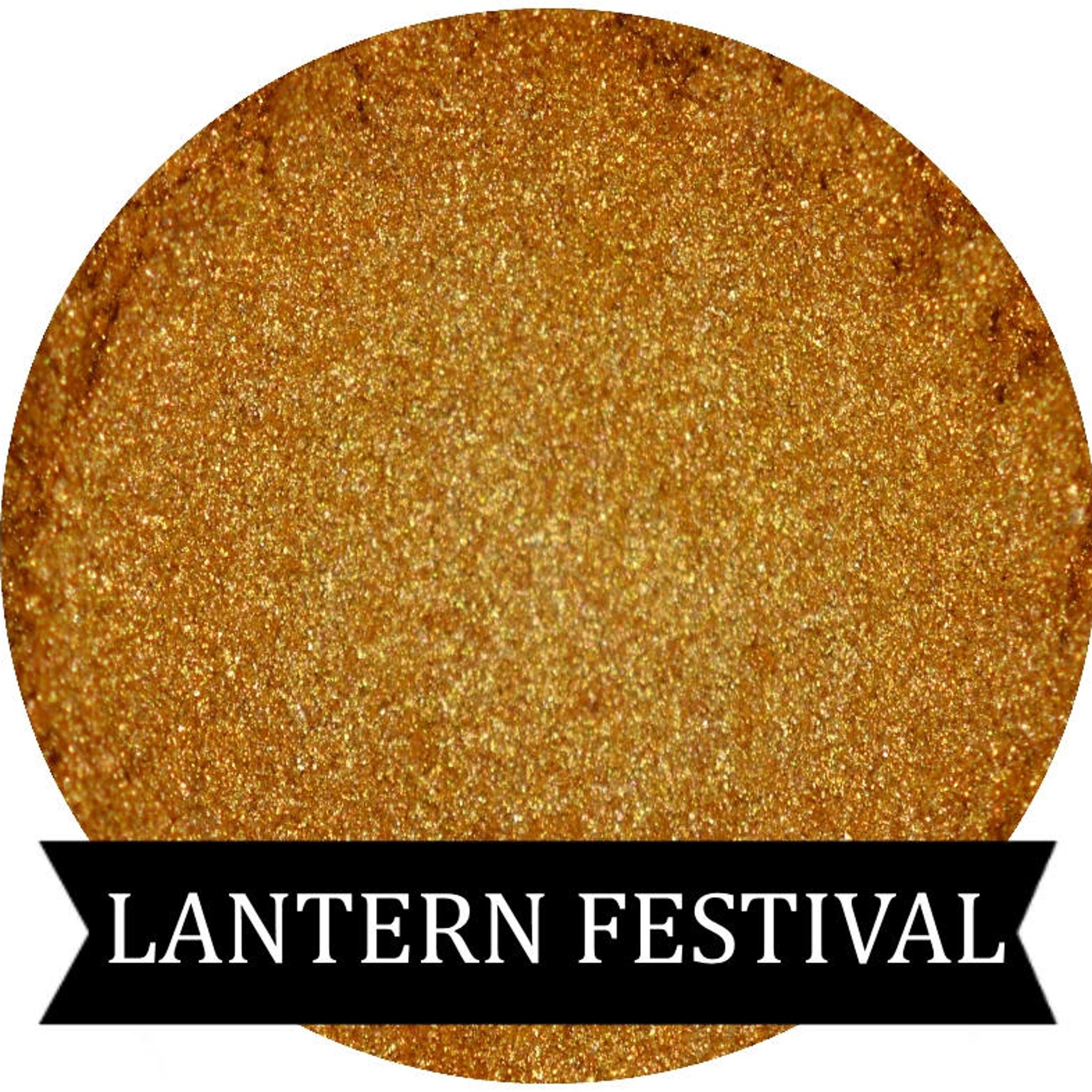 Shimmery gold eyeshadow pan with reflective finish for festive Lantern Festival looks