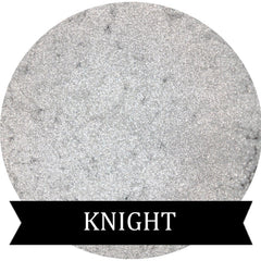 Metallic silver eyeshadow pot with reflective finish and sleek black compact packaging