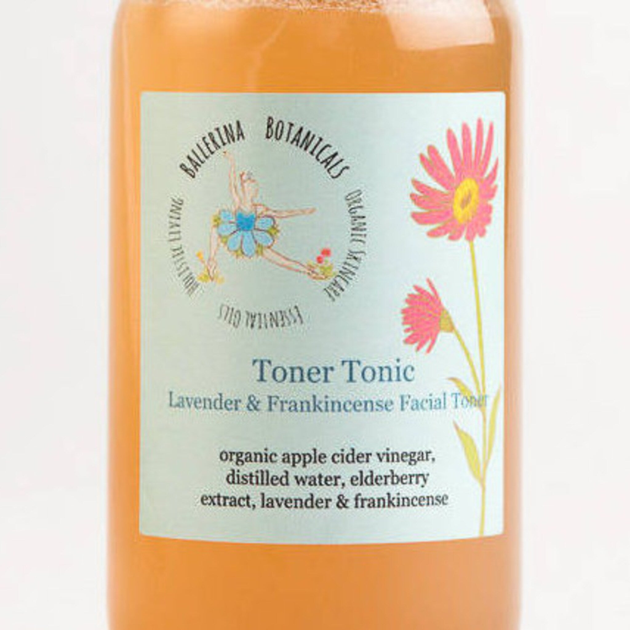 Toner Tonic bottle with orange liquid, light green label, and Ballerina Botanicals text and logo
