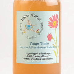 Toner Tonic bottle with orange liquid, light green label, and Ballerina Botanicals text and logo