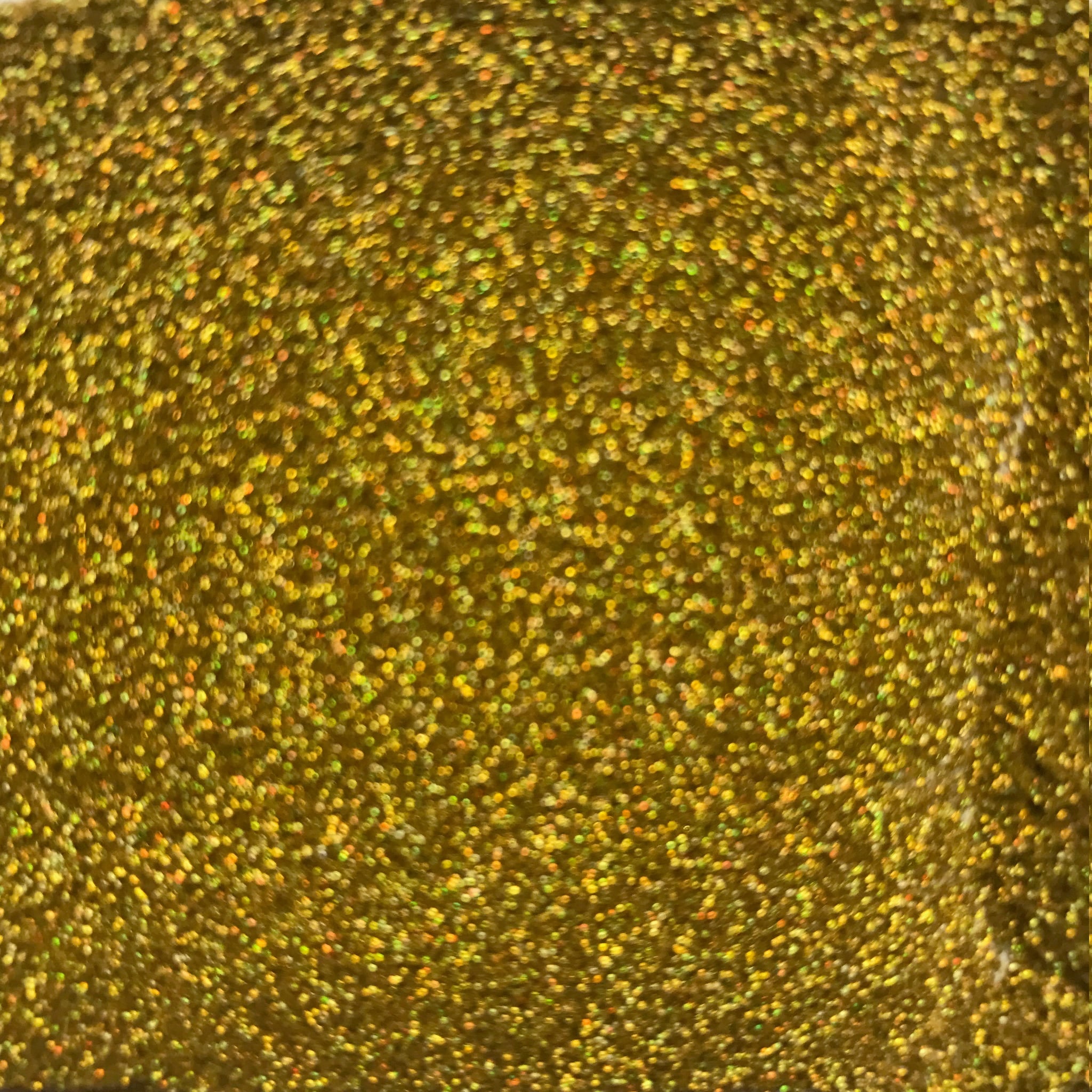Gold glitter background with bokeh effect and reflective texture