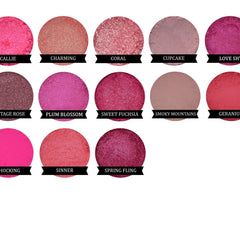 Side view of Sweet Fuchsia mineral eyeshadow in compact case showing vibrant pink shimmer and smooth powder texture