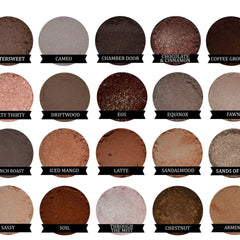 Hand applying dark gold mineral eyeshadow with a fluffy brush for a shimmery eyelid look