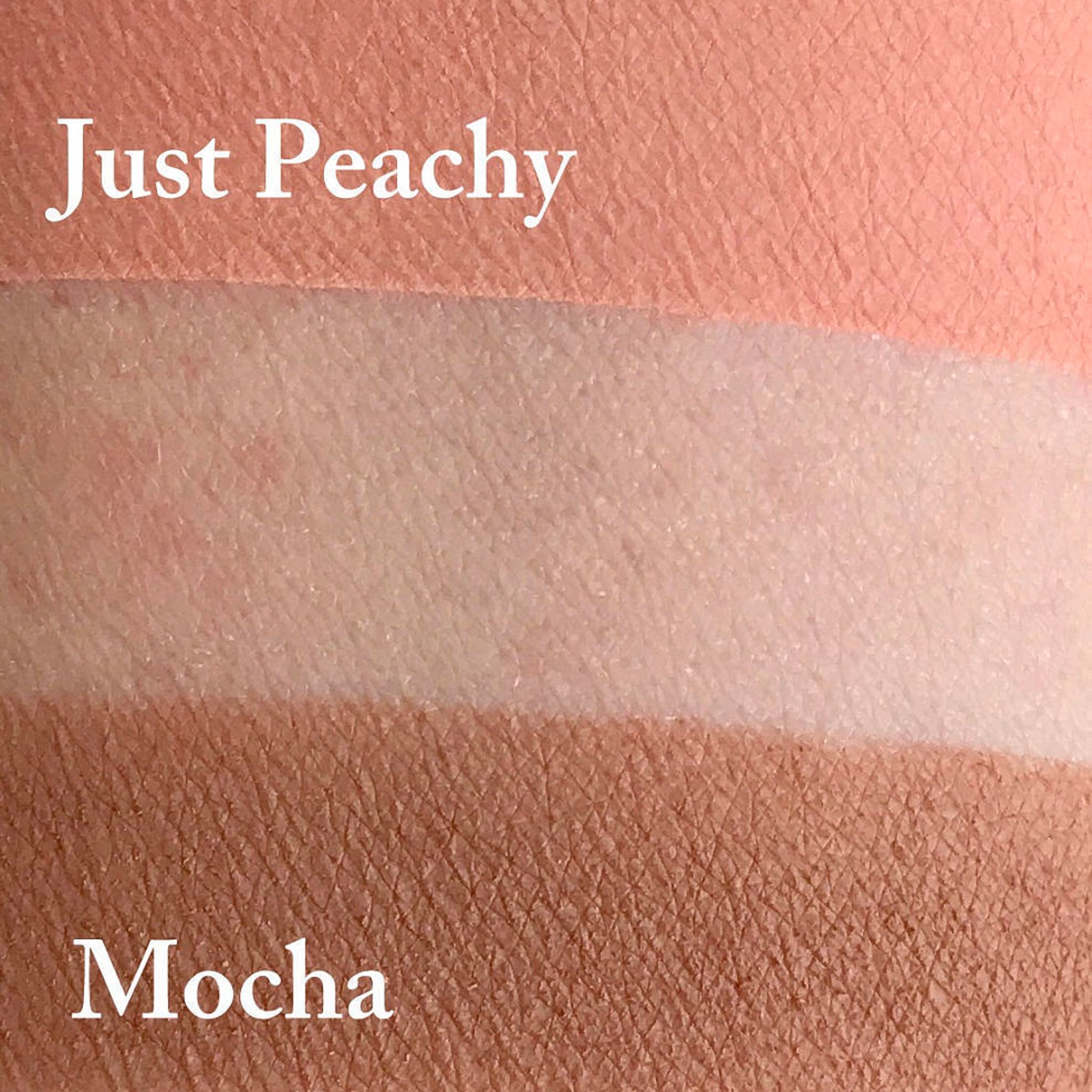 Close-up of matte mocha eyeshadow pan showing rich brown pigment and smooth powder texture