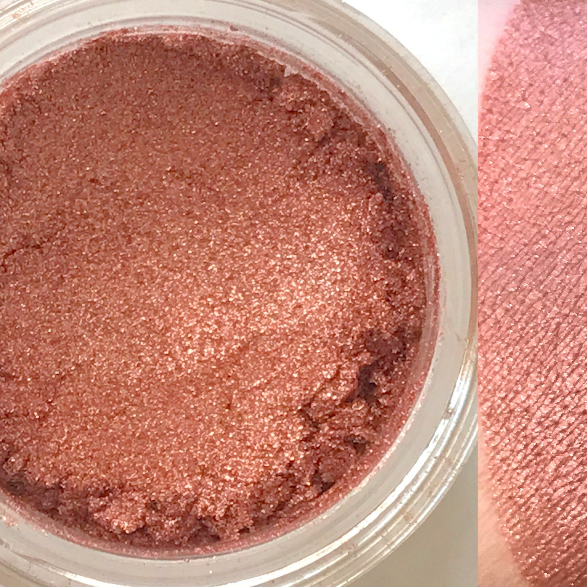Vegan eyeshadow, shimmering rose-gold powder in a clear jar, swatch on skin