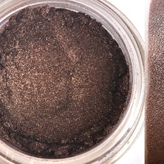 Vegan Bonfire eyeshadow palette with warm orange and red tones in sleek black compact