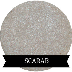 Scarab green iridescent eyeshadow in compact with reflective shimmer and emerald undertones.