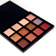 Eyeshadow palette with various colors, black case, and square pans